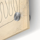 Close-up of an abstract minimalist wall art piece featuring vibrant colors and geometric shapes, presented on sleek acrylic glass for modern decor.