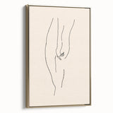 Framed abstract minimalist wall art piece showcasing a gold design on a black canvas, highlighting modern elegance in home decor.