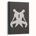 Framed abstract minimalist wall art featuring a black design on canvas, showcasing a modern aesthetic from a side view for home decor.