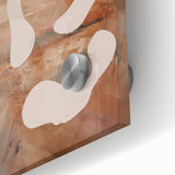 Close-up of an abstract minimalist wall art piece with fluid shapes and harmonious colors, showcasing a modern design on acrylic glass.