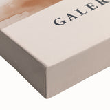 Close-up of a stretched canvas featuring an abstract minimalist design in muted tones, perfect for modern home decor and wall art collections.