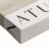 Close-up of a stretched canvas showcasing an abstract minimalist design in soothing earth tones, perfect for modern home decor. The artwork features gentle curves and organic shapes, creating a serene atmosphere ideal for living rooms or offices.