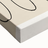 Close-up of a stretched canvas wall art piece featuring an abstract minimalist design with soft pastel colors, showcasing fluid shapes and textures.