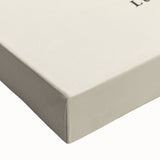 Close-up of an abstract minimalist wall art design on stretched canvas, showcasing soft pastel colors and geometric shapes, perfect for modern decor.