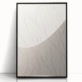 Framed wall art featuring an abstract minimalist design with black accents, displayed in a sleek frame, perfect for modern home decor and aesthetic enhancement.