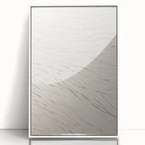 Framed acrylic wall art featuring a minimalist abstract design in soft tones of white and gray, perfect for modern decor. Ideal for enhancing contemporary interiors.