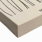 Close-up of a stretched canvas featuring an abstract minimalist design in soft pastel colors, perfect for modern home decor and artistic interior styling.