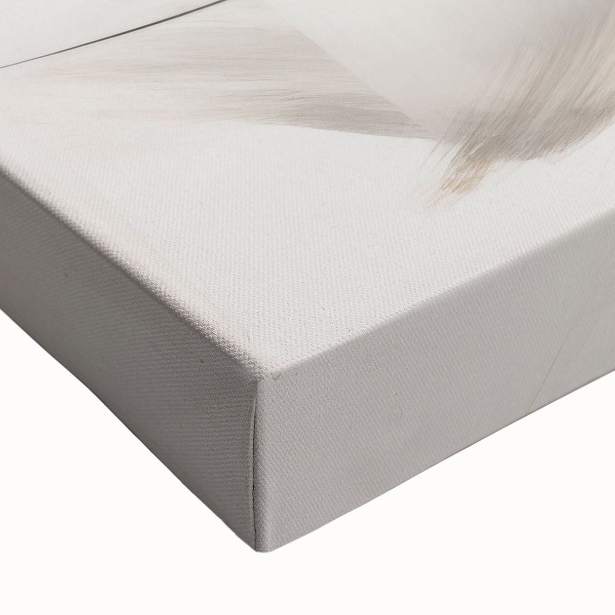 Close-up of a stretched canvas showcasing an abstract minimalist design in muted earth tones, perfect for contemporary home decor, enhancing any living space.
