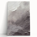 Abstract modern design stretched canvas wall art showcasing vibrant colors and geometric patterns, leaning against a neutral wall for an elegant decor accent.