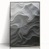 Framed wall art featuring an abstract modern design with a sleek silver finish, ideal for contemporary home decor. This piece adds a touch of elegance and sophistication to any room setting.
