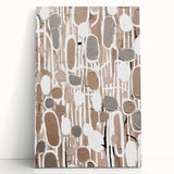 Abstract modern wall art collection featuring a vibrant, colorful design on stretched canvas, leaning against a neutral wall, showcasing bold shapes and textures.