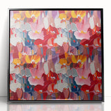 Framed abstract wall art featuring a vibrant splatter design in bold colors, set in a sleek black frame, perfect for modern decor.