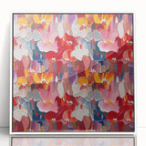 Framed abstract wall art featuring colorful splatter designs on a textured surface, presented in a sleek white frame for a modern aesthetic.