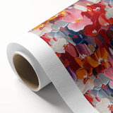 Colorful abstract splatter design on rolled canvas, showcasing vibrant hues of blue, pink, and yellow, ideal for modern decor.