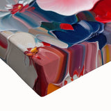 Colorful abstract splatter wall art on stretched canvas, showcasing vibrant hues and dynamic patterns, perfect for modern decor accents.