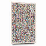 Abstract splatter wall art design in vibrant colors, displayed in an acrylic glass frame with visible pins, ideal for modern decor.