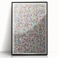 Framed abstract wall art featuring vibrant splatter designs in blue, pink, and yellow, set against a sleek black frame for modern decor.