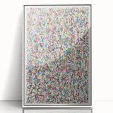 Framed abstract wall art featuring colorful splatters on a white background, perfect for modern decor and enhancing interior spaces.