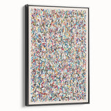Framed abstract wall art featuring colorful splatter designs on canvas, displayed against a black background to enhance vibrancy and depth.