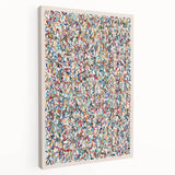 Abstract wall art design featuring vibrant splatter patterns in blue, yellow, and orange on a stretched canvas, showcasing a modern aesthetic ideal for contemporary decor.