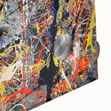 Close-up of vibrant abstract splatter wall art on acrylic glass, showcasing bold colors and dynamic shapes ideal for modern decor.