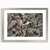 Framed abstract splatter wall art in a sleek silver frame, showcasing vibrant colors and dynamic patterns, perfect for modern decor.