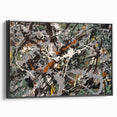 Framed abstract wall art with colorful splatter designs on a black canvas, showcasing modern artistic flair and visual depth from a side view.