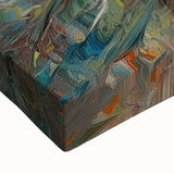 Colorful abstract splatter design on stretched canvas showcasing vibrant hues of blue, yellow, and pink, ideal for modern decor accents.