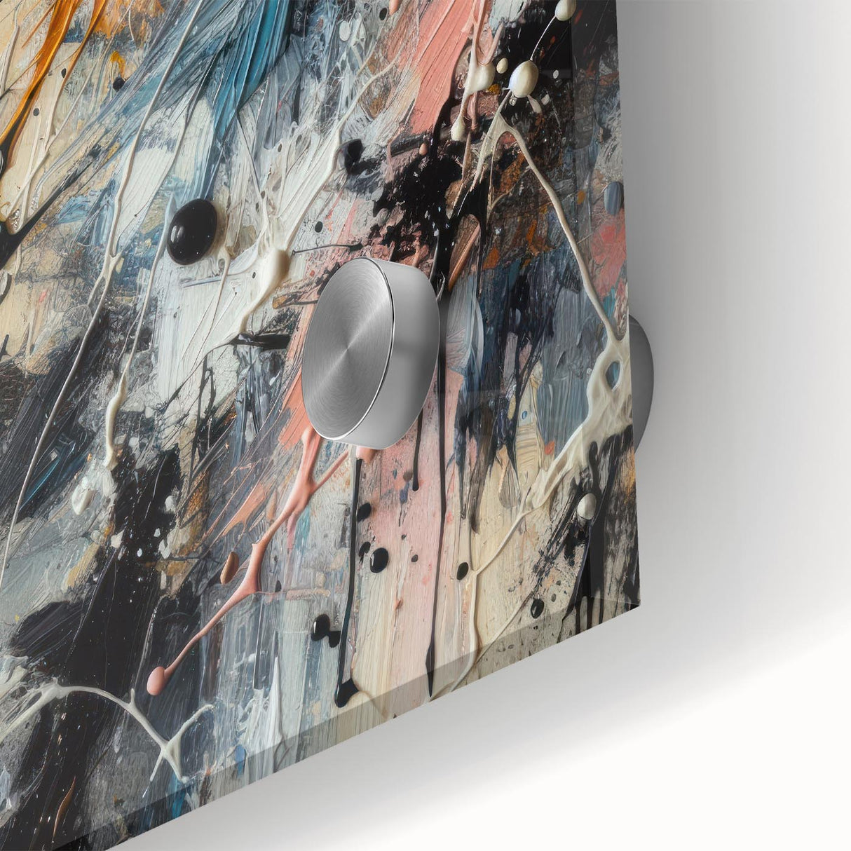 Close-up of an abstract wall art piece showcasing vibrant splatter designs in shades of blue, yellow, and red, ideal for modern decor.