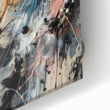 Close-up of an abstract wall art piece showcasing vibrant splatter designs in shades of blue, yellow, and red, ideal for modern decor.
