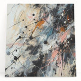 Colorful abstract splatters on stretched canvas wall art, showcasing vibrant hues and dynamic patterns, ideal for modern decor.