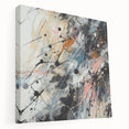 Stretched canvas wall art showcasing vibrant abstract splatters in blue, orange, and yellow hues, perfect for modern decor.