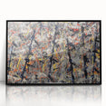 Framed abstract wall art featuring colorful splatters on a black background, enhancing modern decor with a vibrant artistic touch.