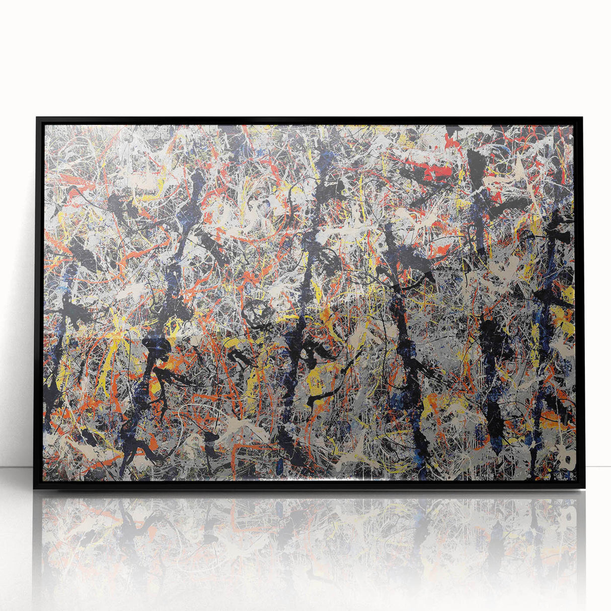 Framed abstract wall art featuring colorful splatters on a black background, enhancing modern decor with a vibrant artistic touch.