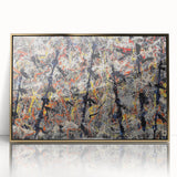 Framed abstract wall art featuring vibrant gold and black splatter designs, elegantly showcased in a sleek acrylic frame against a white background.