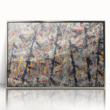 Framed wall art featuring an abstract splatter design in vibrant colors, set in a sleek silver frame, perfect for modern decor.