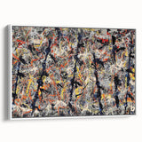 Framed wall art featuring an abstract splatter design in vibrant colors, showcasing a modern aesthetic with a sleek white frame, ideal for contemporary decor.