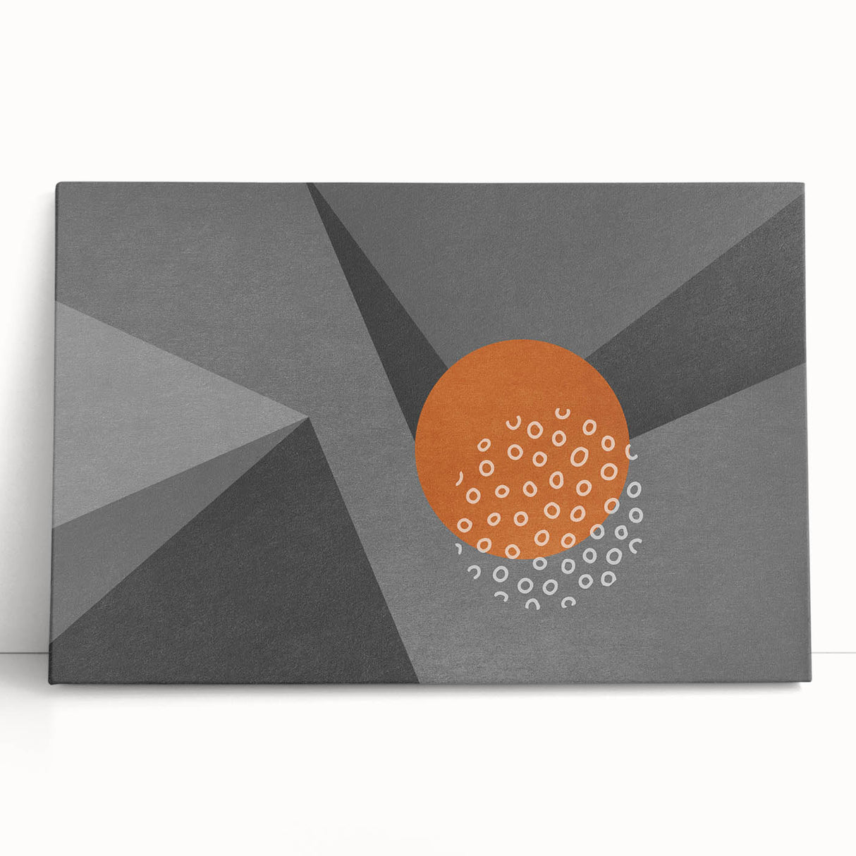 Abstract wall art featuring vibrant strokes and lines in bold colors, displayed on a stretched canvas that leans against a textured wall, ideal for modern decor.