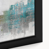 Close-up of a framed abstract wall art piece showcasing vibrant strokes and lines in blue, orange, and gold colors, adding modern flair to decor.