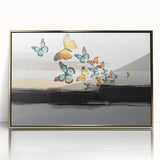 Framed abstract wall art showcasing vibrant strokes and lines in gold and black, adding a modern touch to contemporary decor.