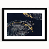 Framed abstract wall art featuring dynamic strokes and lines in earthy tones, set in a sleek black frame with a white mat, ideal for modern decor.