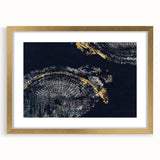 Framed wall art featuring an abstract design of gold strokes and lines on a white background, perfect for modern home decor.