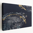 Abstract wall art featuring vibrant strokes and lines in shades of blue, gold, and black on stretched canvas, ideal for modern decor.