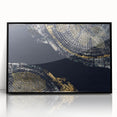 Framed wall art featuring an abstract design of colorful strokes and lines on a black background, adding a modern touch to any decor.