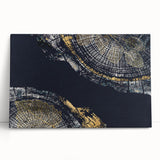 Abstract wall art featuring vibrant strokes and lines in shades of blue, pink, and gold on a stretched canvas, perfect for modern decor.