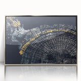 Framed abstract wall art featuring dynamic strokes and lines in silver and gray, adding a modern touch to any interior decor setting.