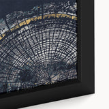 Close-up of framed abstract wall art featuring vibrant strokes and lines in shades of blue, orange, and yellow, ideal for modern decor.