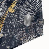 Close-up of an abstract wall art piece showcasing vibrant strokes and lines in shades of blue, orange, and green, printed on acrylic glass for a modern aesthetic.