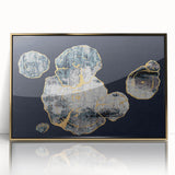 Framed wall art featuring an abstract design of intertwined strokes and lines in gold and white, set against a neutral background, ideal for modern decor.