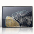 Framed wall art showcasing an abstract design with colorful strokes and lines on a black background, ideal for modern home decor and artistic interiors.